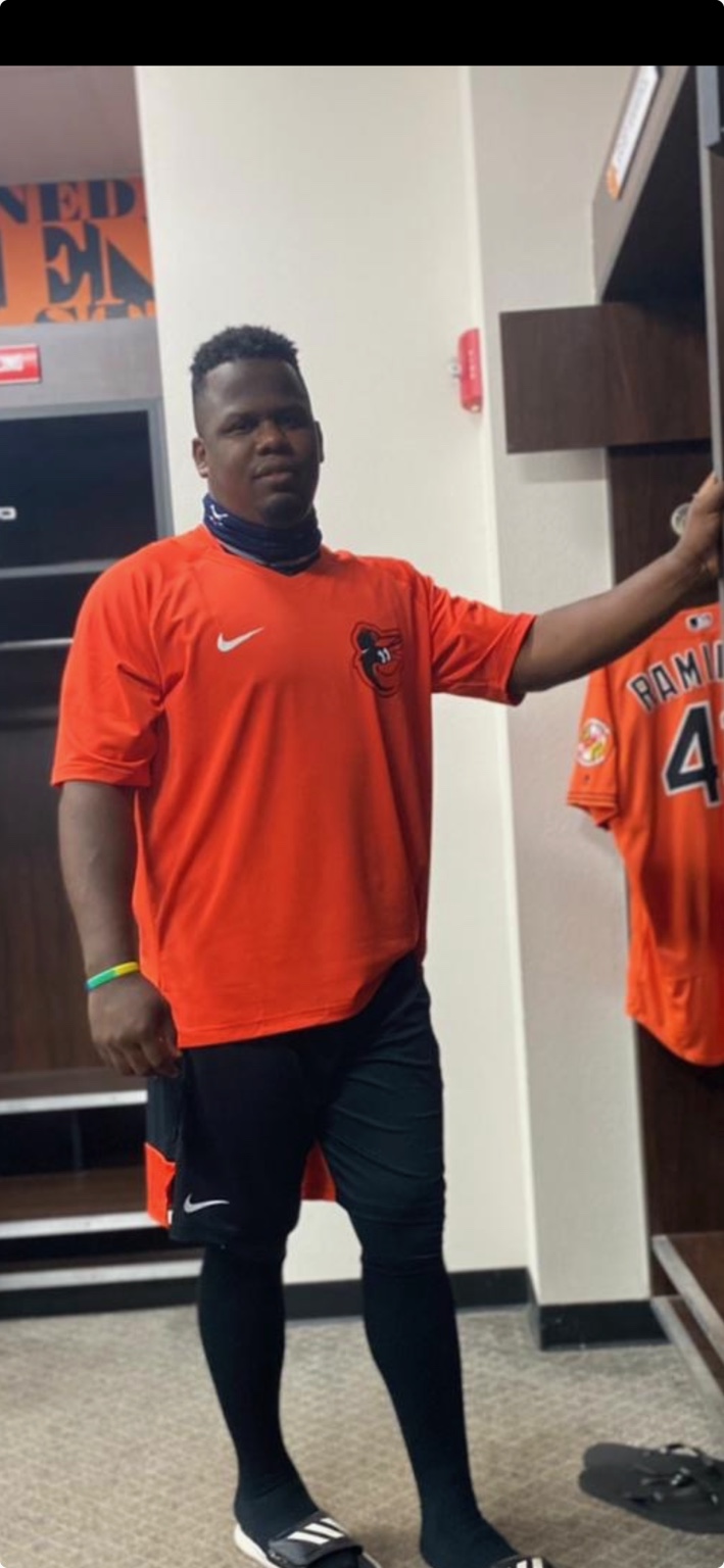 Coach Deiby in a baseball locker room